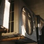 Close-up of an air conditioning unit on a sunny day.