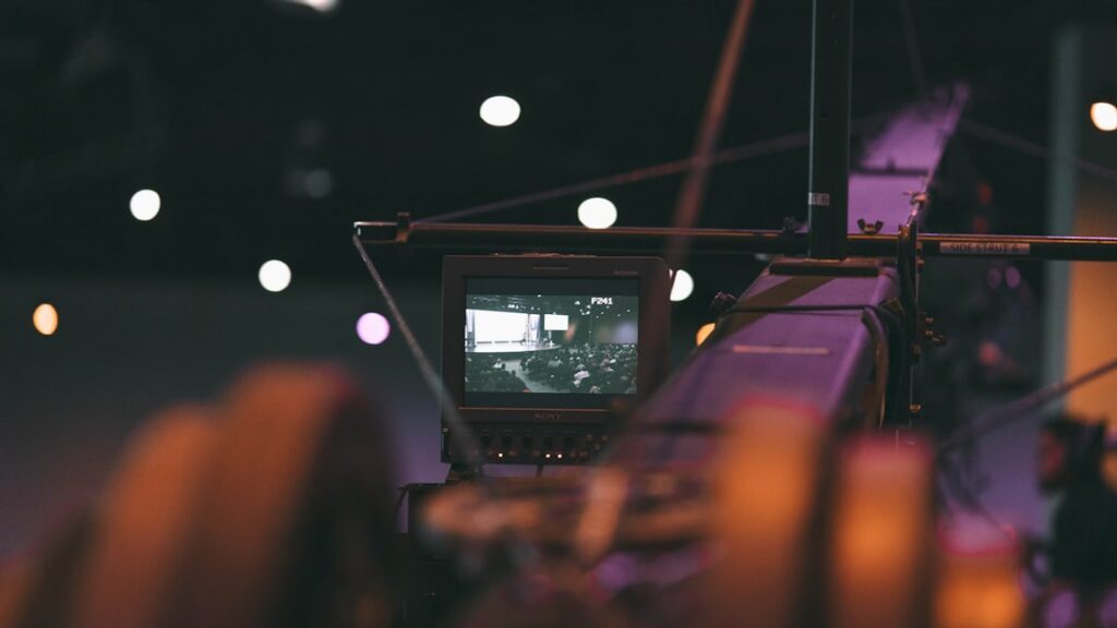 black laptop computer turned on on the stage