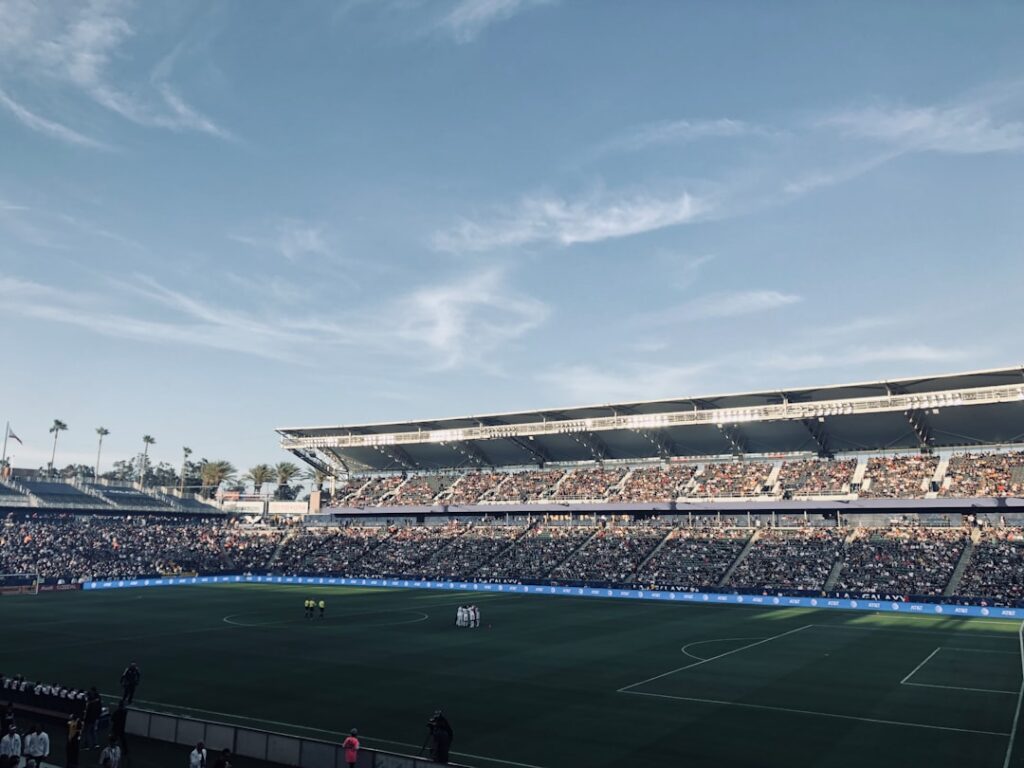 a stadium full of people watching a soccer game