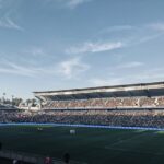 a stadium full of people watching a soccer game