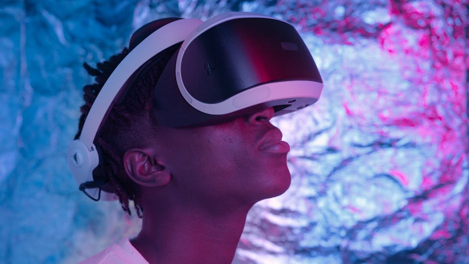 Close-up of a person wearing VR glasses in a neon-lit environment, showcasing technology and user experience.