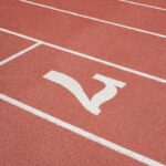 a red running track with a white line on it