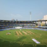 A cricket stadium filled with lots of people