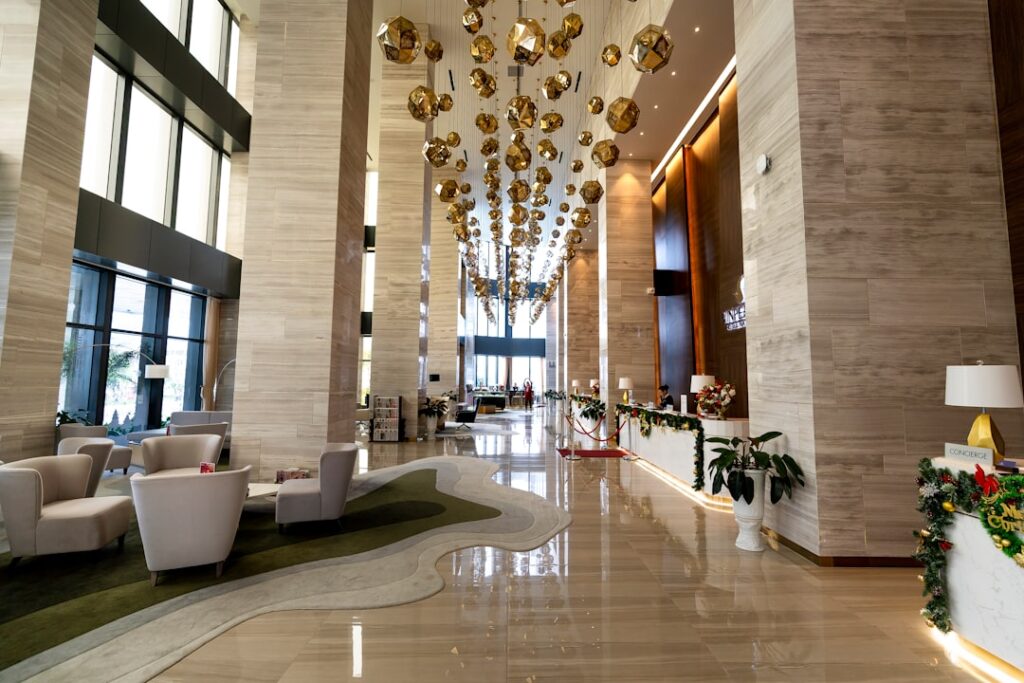 a hotel lobby with a chandelier hanging from the ceiling