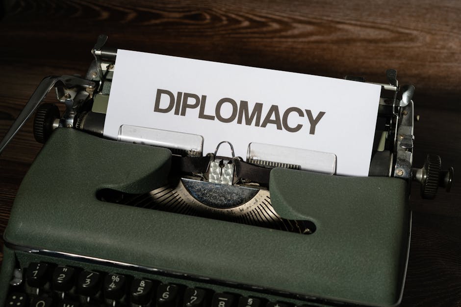Close-up of a vintage typewriter with the word 'Diplomacy' on a paper sheet.