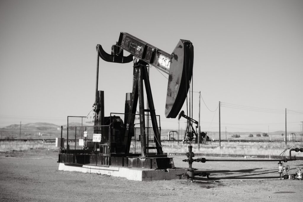 a black and white photo of an oil pump