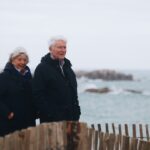 a couple of people standing next to each other