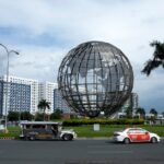 Large globe sculpture in Manila, capturing urban architecture and vibrant city life.