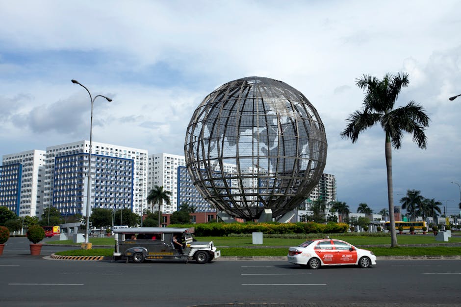 Large globe sculpture in Manila, capturing urban architecture and vibrant city life.