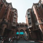 A stunning low angle view of St. Anthony of Padua Church facade in Istanbul with people walking.