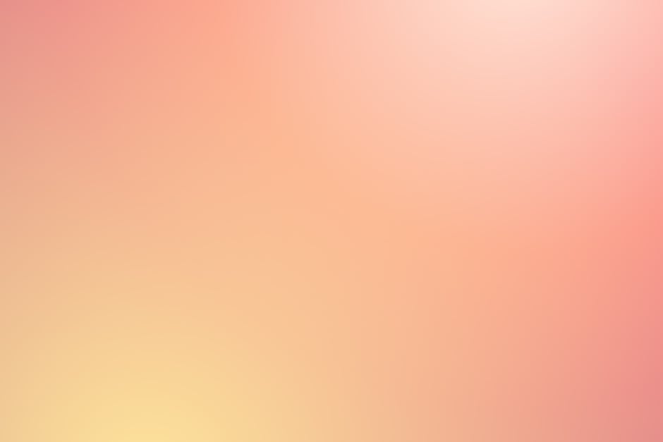 Soft abstract gradient background in pink and yellow hues