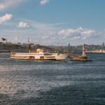 Scenic view of a ferry passing a lighthouse in the Bosphorus, Istanbul.