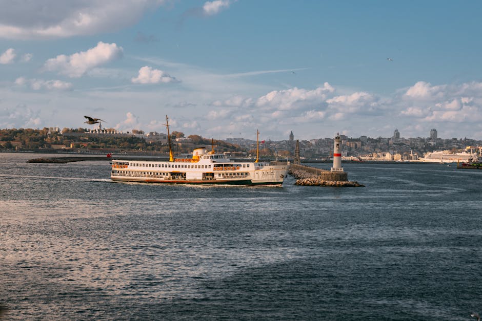 Scenic view of a ferry passing a lighthouse in the Bosphorus, Istanbul.