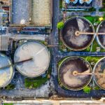 Top-down view of a water treatment plant in an industrial area of Indonesia.
