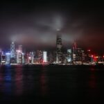 Stunning view of Hong Kong's illuminated skyline reflecting over the water at night.