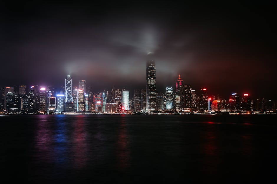 Stunning view of Hong Kong's illuminated skyline reflecting over the water at night.