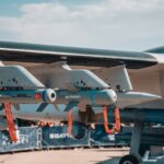 Detailed view of armaments on a Turkish military aircraft displayed at an air show.