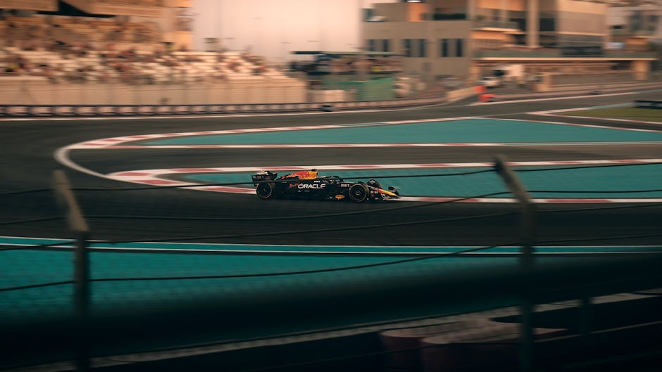 Exciting Formula 1 car racing on the Yas Marina Circuit, Abu Dhabi.