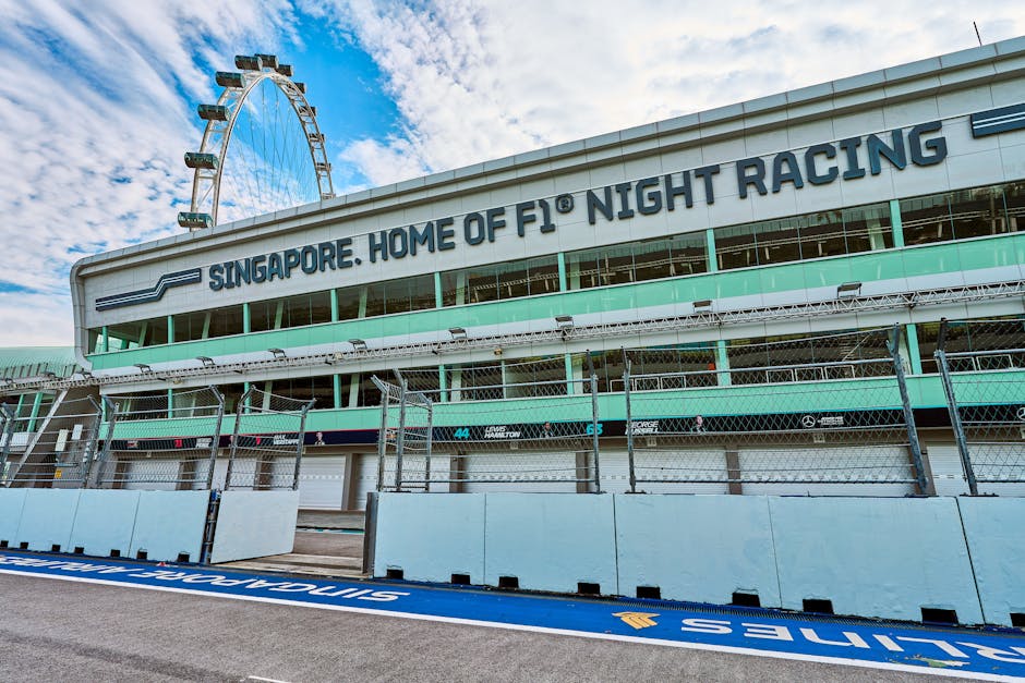 Empty Singapore Grand Prix F1 circuit during the day, showcasing race track and Singapore Flyer.