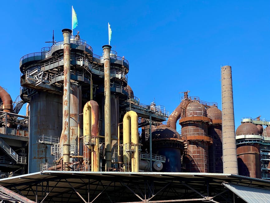A view of the historic Völklingen Ironworks industrial facility under a clear blue sky.
