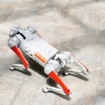 High-tech robotic dog on a tiled surface, showcasing cutting-edge robotics.