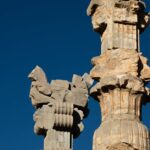 Detailed view of ancient stone columns in Persepolis, Iran.