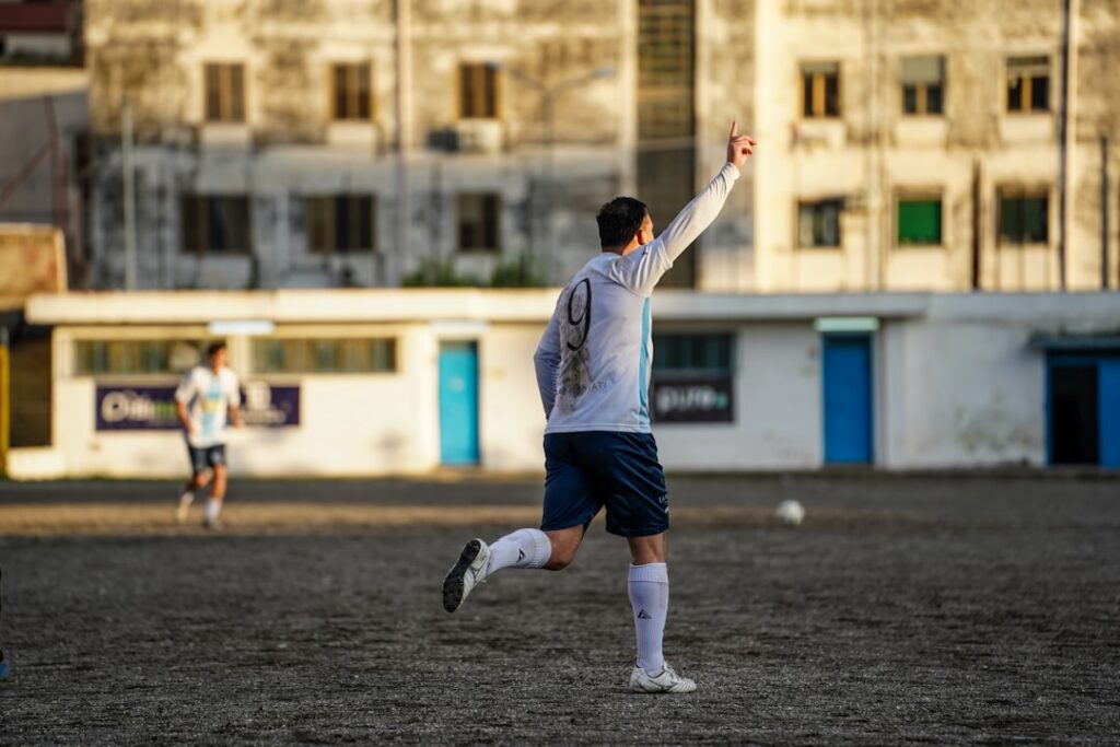 Soccer player celebrates scoring a goal on field