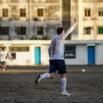 Soccer player celebrates scoring a goal on field