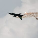 a fighter jet flying through the air