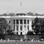 Black and white photo of the White House, a symbol of U.S. government, in Washington, DC.
