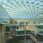 A bright, modern building with a glass ceiling.