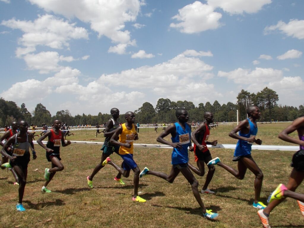 Runners running at the Discovery Kenya Cross Country event in Eldoret, Kenya