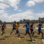 Runners running at the Discovery Kenya Cross Country event in Eldoret, Kenya