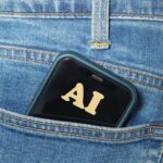 Smartphone with ai text in jeans pocket