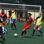 girls playing soccer