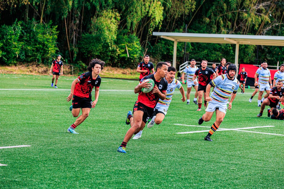 Rugby players competing vigorously on a vibrant green field, showcasing teamwork and athleticism.
