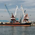Cargo ships and cranes at the industrial port in Rasht, Gilan Province, Iran.
