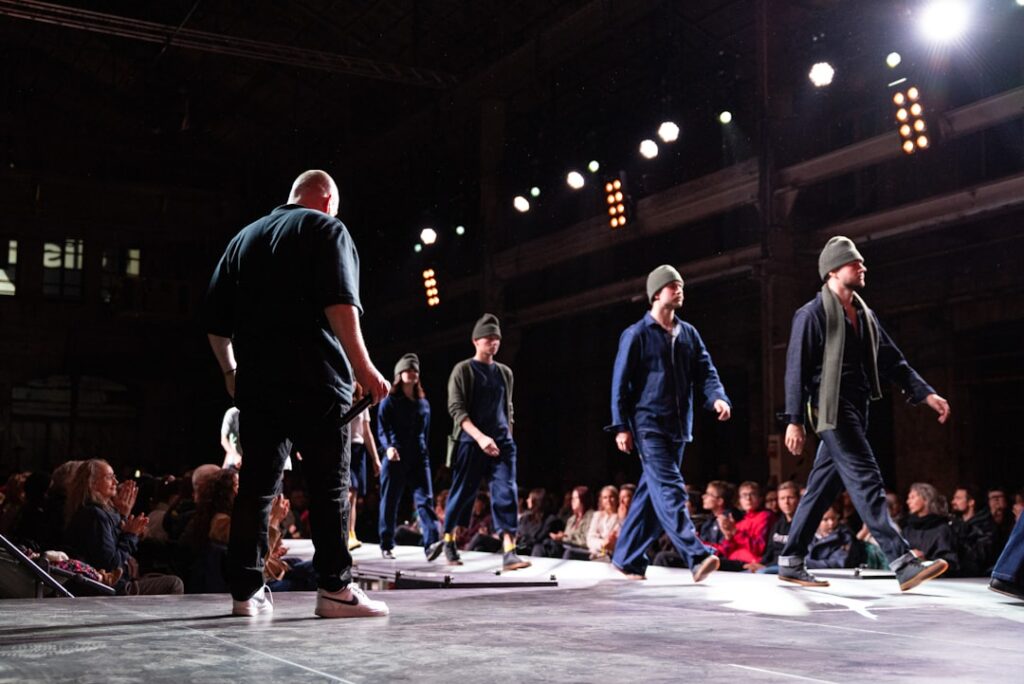 Models walking on a runway during a fashion show.