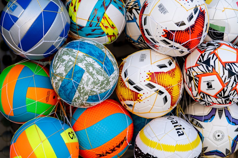 Vibrant collection of soccer balls with various patterns and colors.