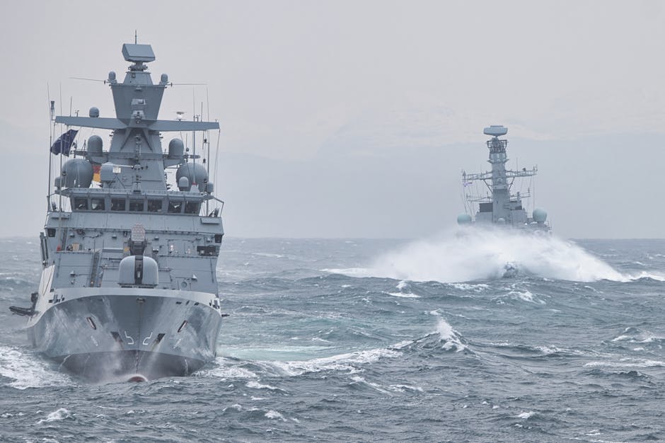 Navy warships navigating turbulent ocean waters showcasing maritime strength.
