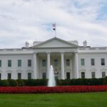 The white house is prominently featured in the image.