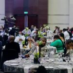 a group of people sitting around a table