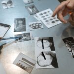 Investigation scene with evidence photos discussed. Officers analyze suspect details.