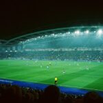 a soccer match in a stadium at night