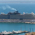 A large cruise ship docked in a harbor