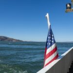 An american flag is on the side of a boat