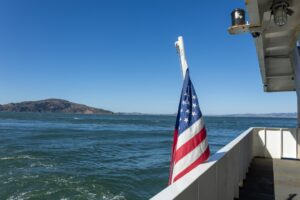 An american flag is on the side of a boat