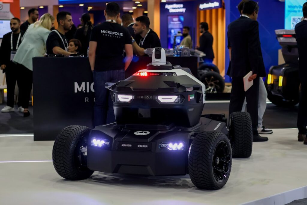 Autonomous security robot vehicle showcased at a technology exhibition, highlighting robotics innovation, smart surveill