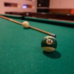 pool table, balls and cue