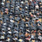 A see of college graduates at the commencement ceremony. If you use this photo, please consider crediting https://www.go